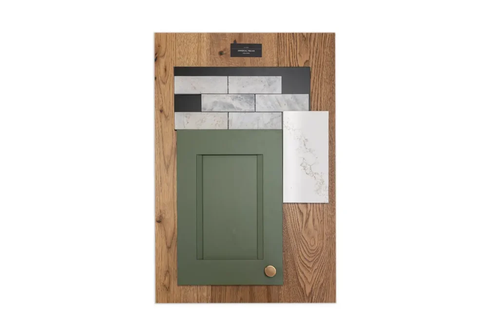 A mood board for a showroom page featuring a wood sample, grey and white tile, white countertop sample, and a green cabinet door with a gold knob.
