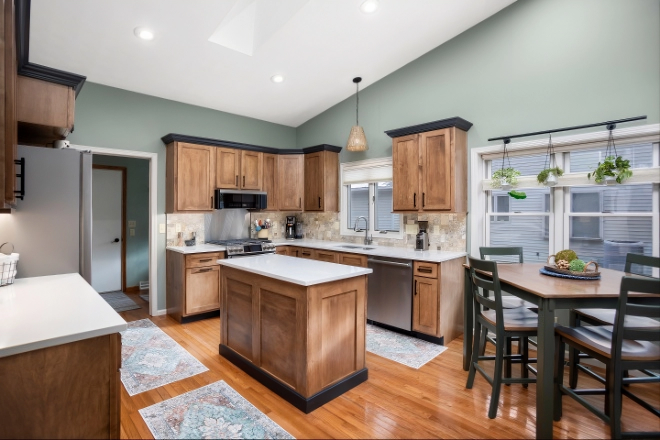 What-is-either-or-both-an-L-shaped-kitchen-layout-and-or-a-U-shaped-kitchen-layout-with-brown-cabinets-and-an-open-concept-design
